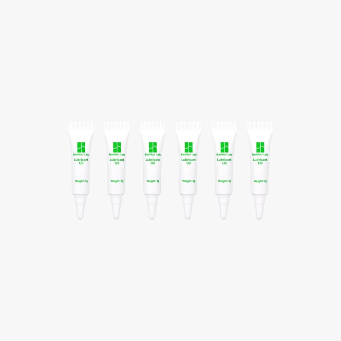 Bambu Lab Lubricant Oil bottle with white cap and clear label, used for maintaining 3D printer parts and machinery.