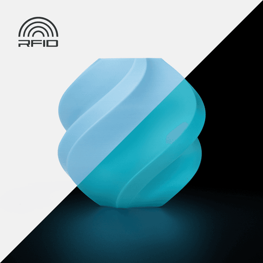 Bambu PLA Glow - Blue 3D-printed color sample, shown in daylight and glowing in the dark