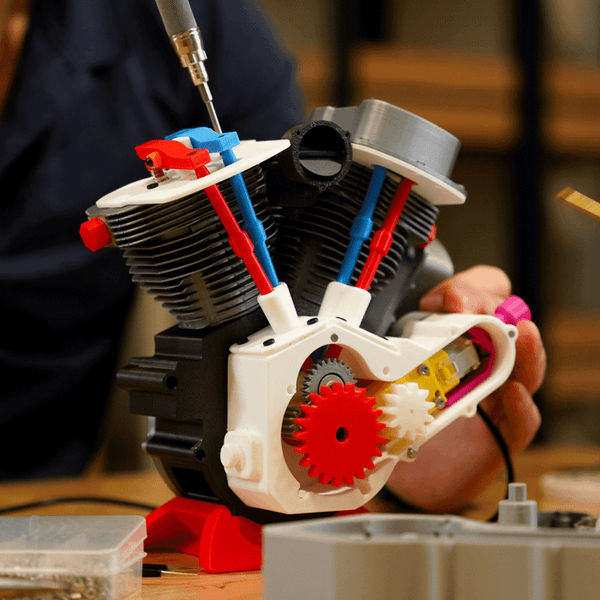 Bambu Lab Engine Model Components Kit showing various small, detailed parts for 3D printer assembly and maintenance.