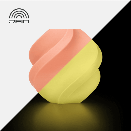 Bambu PLA Glow - Orange 3D-printed color sample, shown in daylight and glowing in the dark