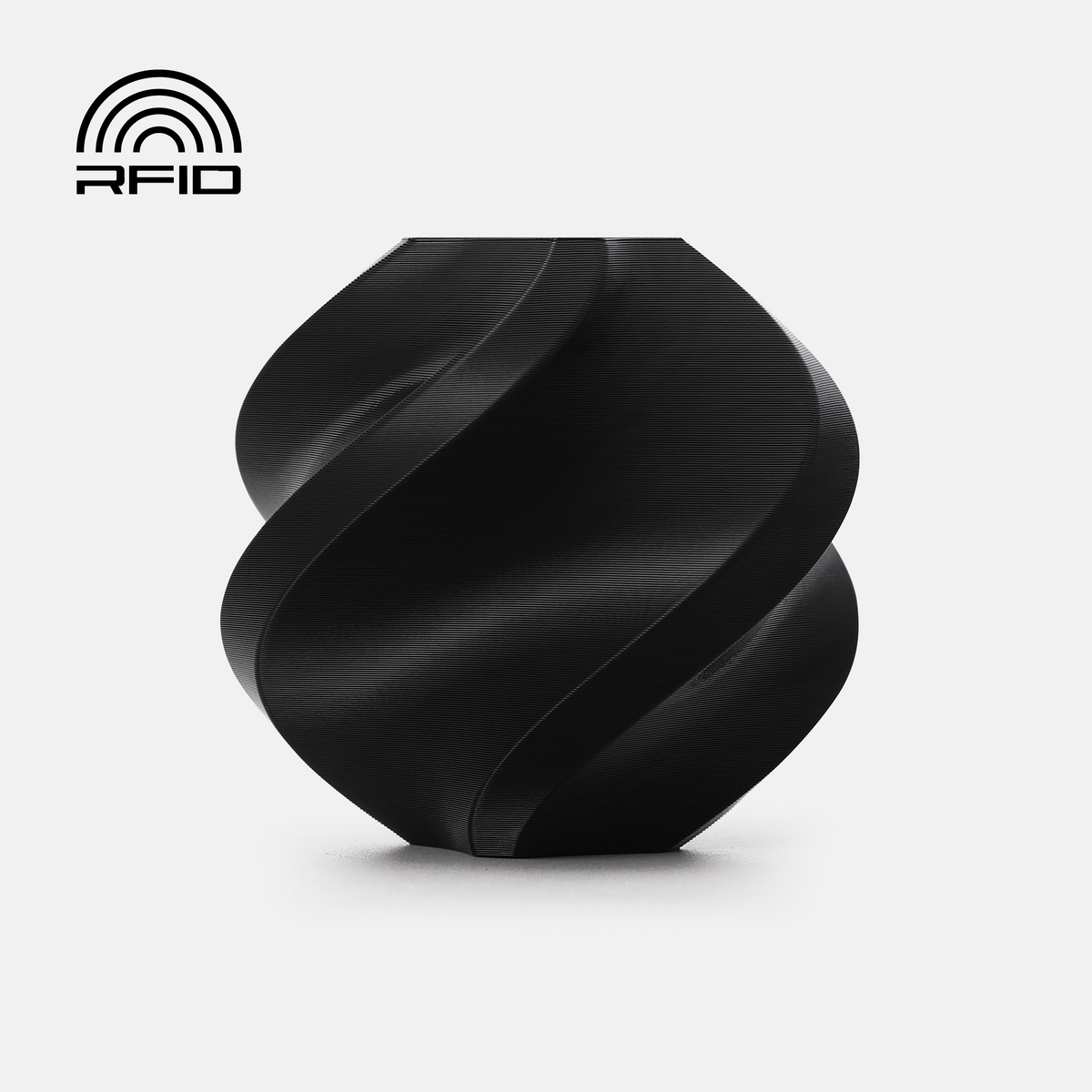 Black Bambu Lab PETG Basic Filament spool for 3D printing, showcasing the filament's smooth, shiny surface and packaging.