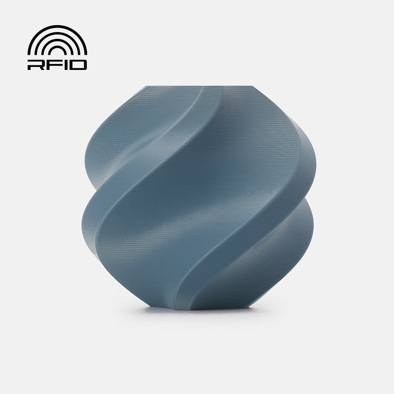 Bambu Lab PETG Basic Filament in Misty Blue, 3D printing filament roll with vibrant blue color and smooth texture.